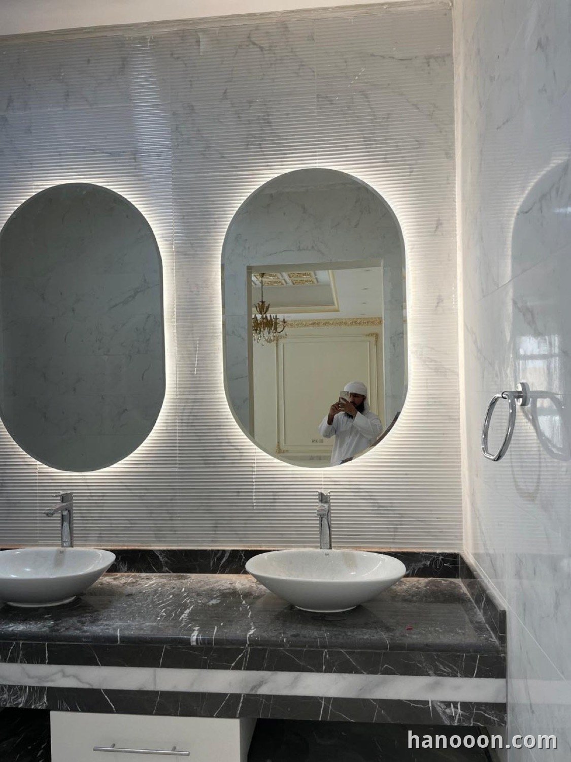 Custom glass and mirror work by Hanooon — backlit LED mirror, etched or fluted glass, completed installation Abu Dhabi UAE