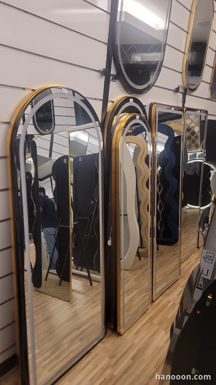 Custom glass and mirror work by Hanooon — backlit LED mirror, etched or fluted glass, completed installation Abu Dhabi UAE