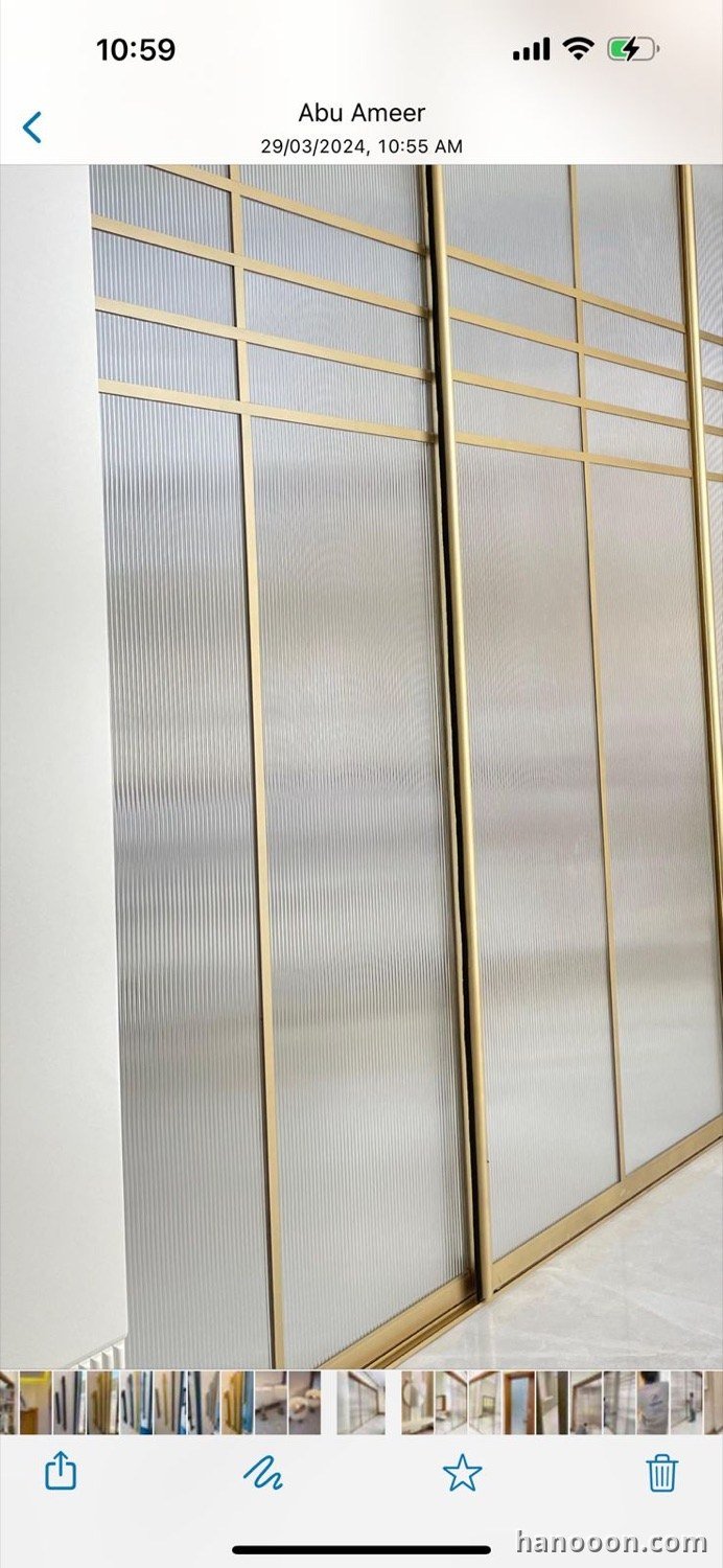 Custom glass and mirror work by Hanooon — backlit LED mirror, etched or fluted glass, completed installation Abu Dhabi UAE