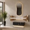 Sculptural gold entrance console with organic LED mirror — handcrafted in the UAE