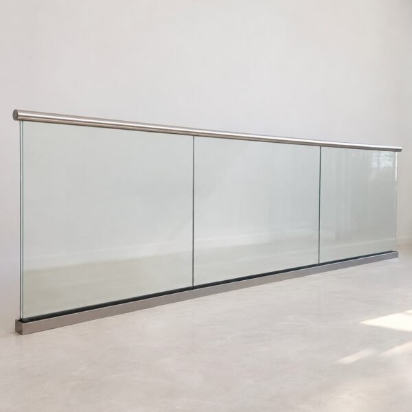 Frameless clear tempered glass staircase balustrade with slim stainless-steel handrail on a plain white background