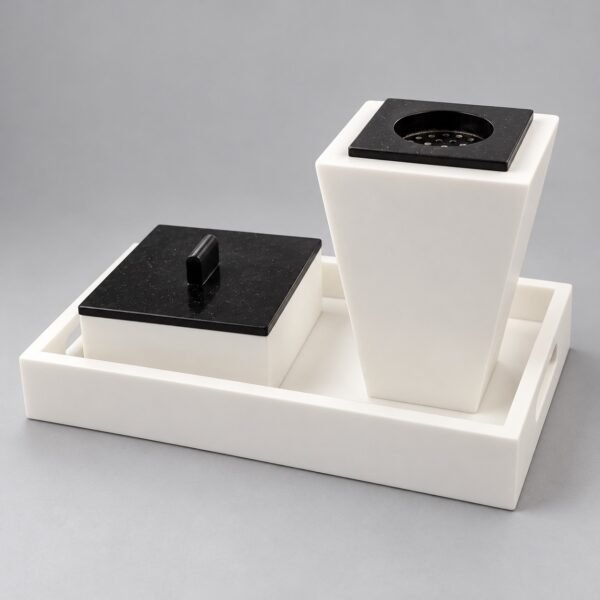 White Corian bakhoor set with black lids on a tray