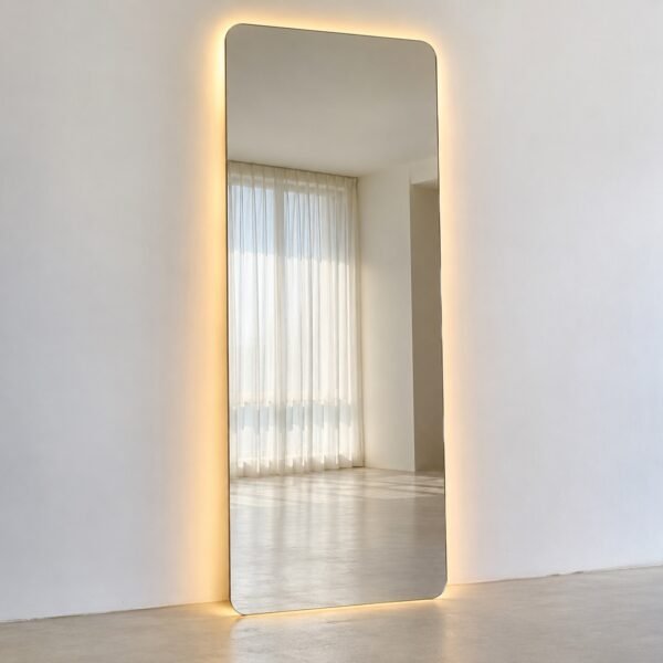 Aura Edge frameless rounded full-length backlit floor mirror on a plain white wall