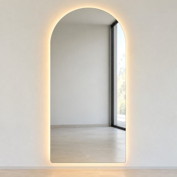 Front view of a 60 x 120 cm backlit arch vanity mirror with a warm LED halo on a plain white wall