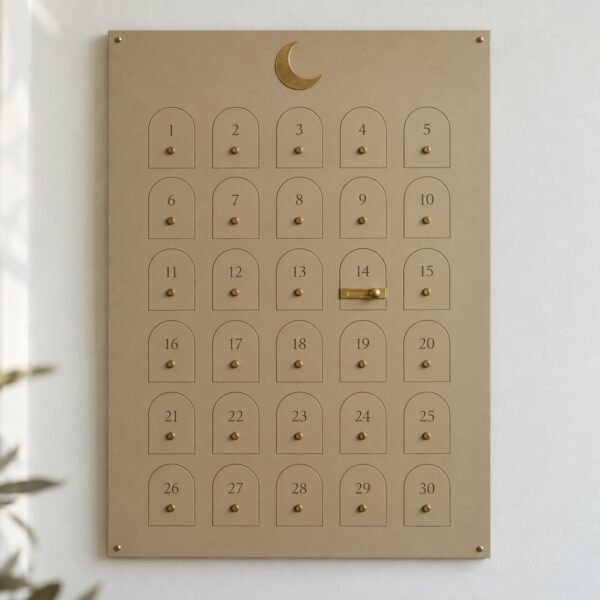 Sand-colour steel Ramadan 30 Day Countdown Board with crescent and brass marker on a white wall