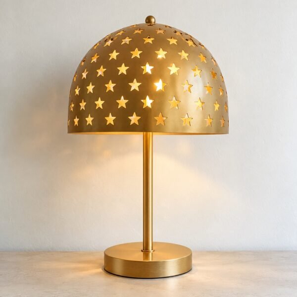 Gold Star Shadow Table Lamp with laser-cut dome on a plain white background