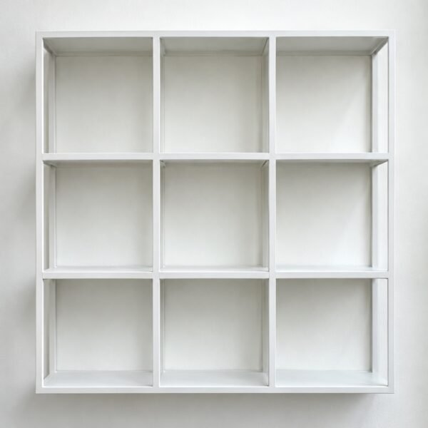 Matte white steel Cube Grid Wall Shelf with nine open square cubes on a plain white wall.