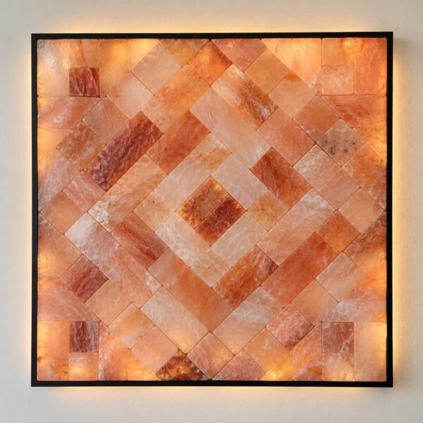 Square framed pink Himalayan salt mosaic art panel on a plain white wall, front view.