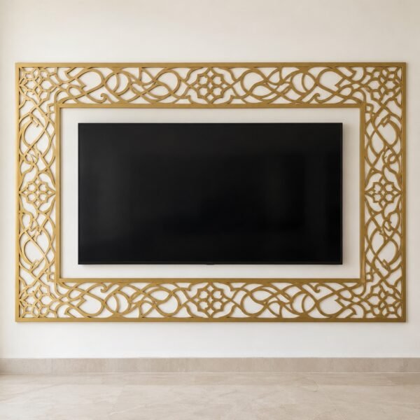 gold laser-cut ornamental steel TV feature wall on a plain white wall, straight front view