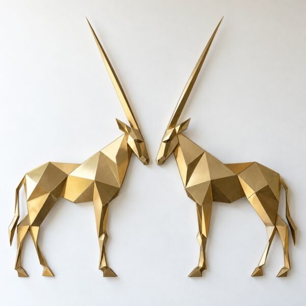 Champagne-gold PVD steel wall sculpture of two Arabian oryx facing each other on a plain white wall