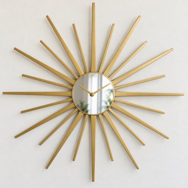 Round gold Sunburst Rays wall clock with 24 alternating steel rays on a plain white wall.