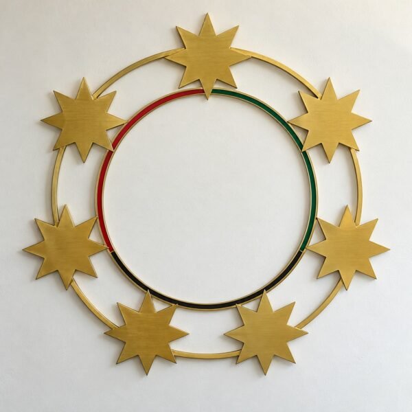 Seven brushed gold steel eight-point stars forming a circular wall ring with a thin red green and black inner ring on a white wall