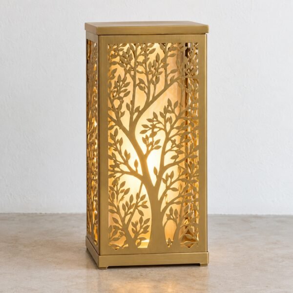Gold PVD steel Ghaf Tree Union Lantern with warm LED glow, front view on a light floor.