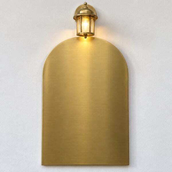 Blank gold PVD arch villa entrance name plate with integrated lantern on a white wall