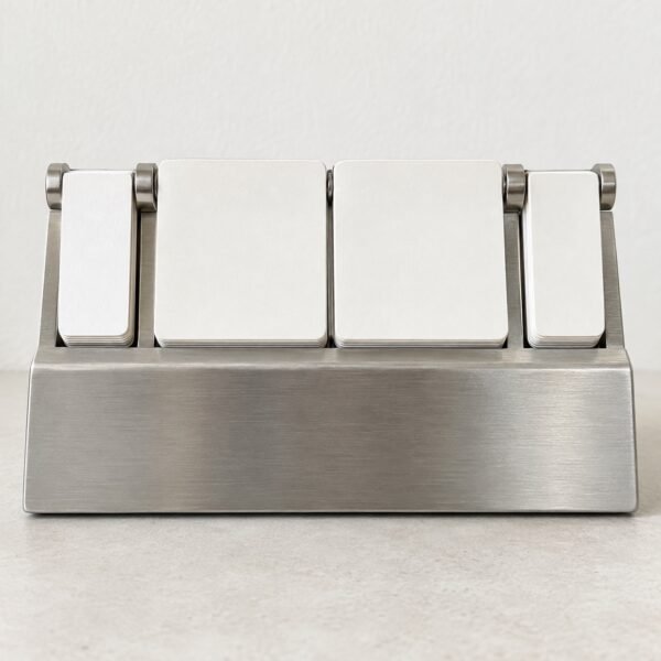 Brushed steel desk calendar block with blank flip tiles on a light background