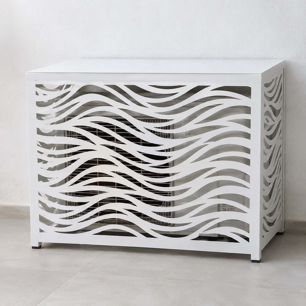 White rectangular AC condenser cover with flowing wave laser-cut pattern, front view
