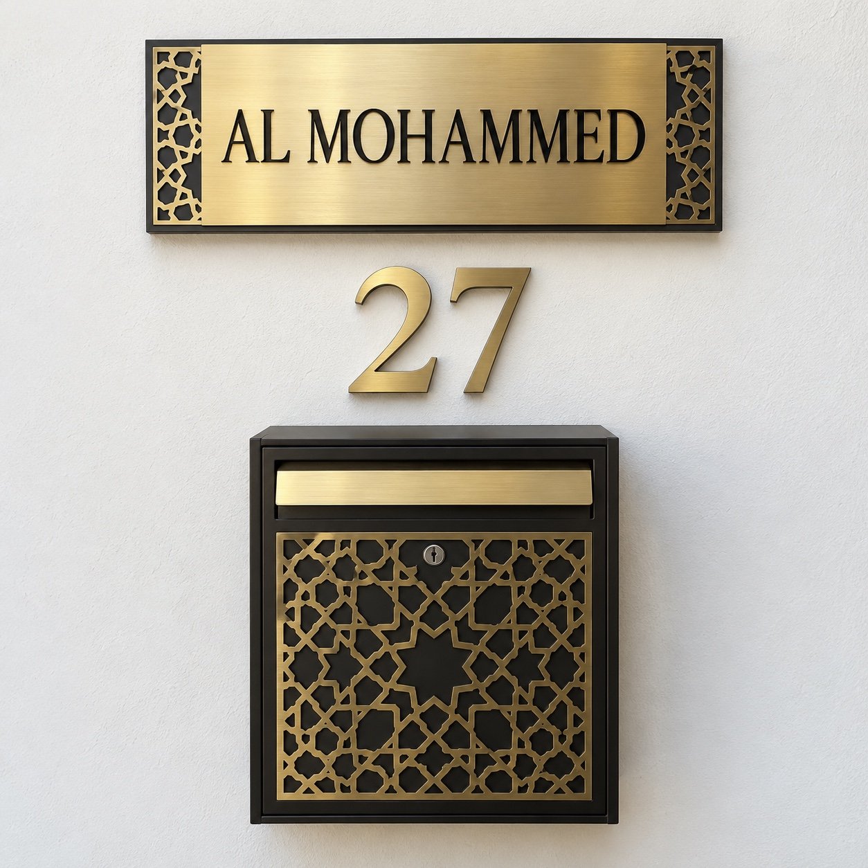 UAE villa entrance set with gold PVD AL MOHAMMED name plate, number 27 and arabesque mailbox on a white wall