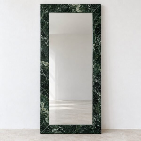 Front studio view of a tall rectangular floor mirror with a deep green veined marble frame on a white wall.