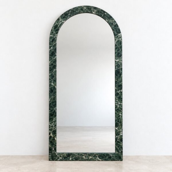 Front studio view of a tall arched floor mirror with a deep green veined marble frame.