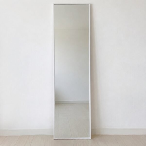 Sadaf Line white rectangular leaner mirror standing against a plain white wall