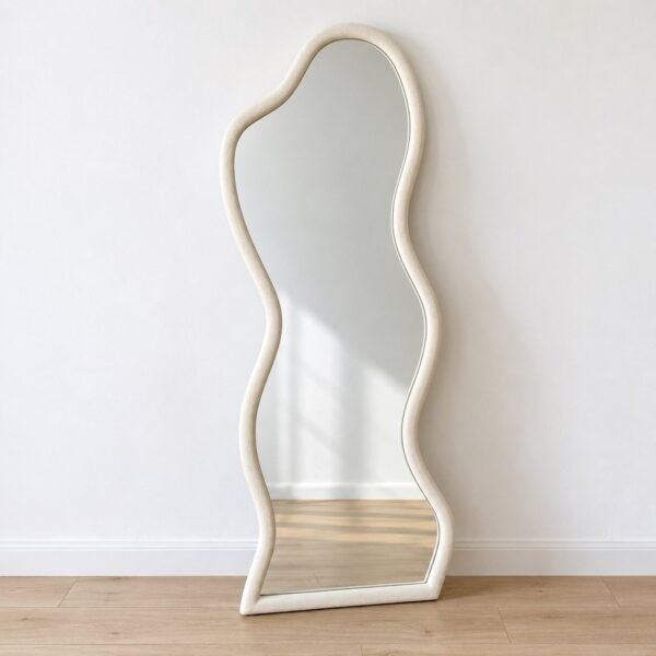 Sahra Ripple organic off-white leaner mirror standing against a plain white wall