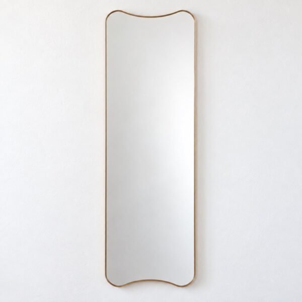Safa organic wall mirror with a slim champagne-gold metal frame on a white wall