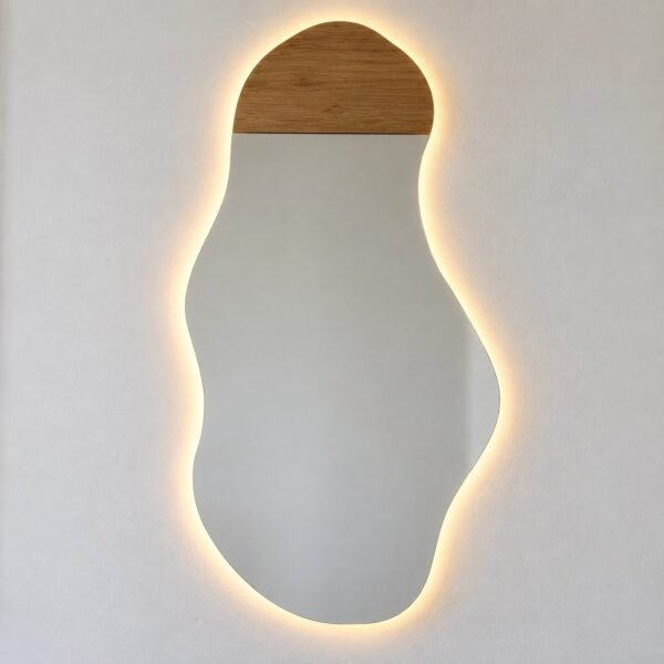 Miraa Woodline Glowform organic LED wall mirror with a warm wood cap on a white wall.
