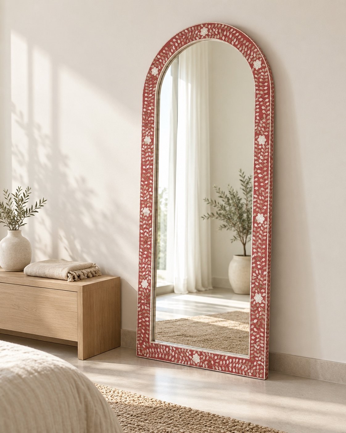 Ayla full-length arched floor mirror beside a light wood console in a bright room