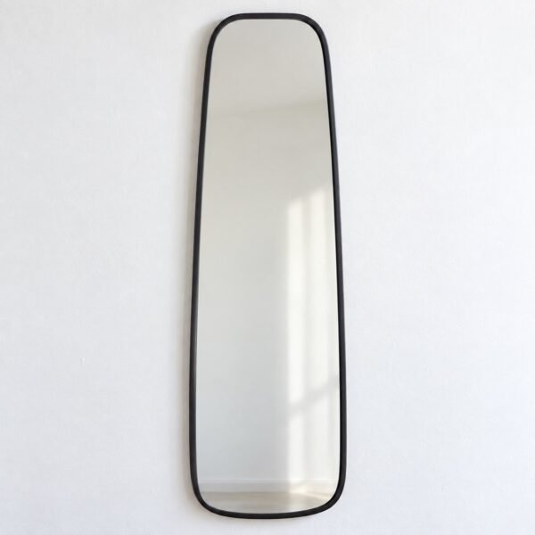 Samaa slim capsule wall mirror with a dark charcoal metal frame on a plain white wall.