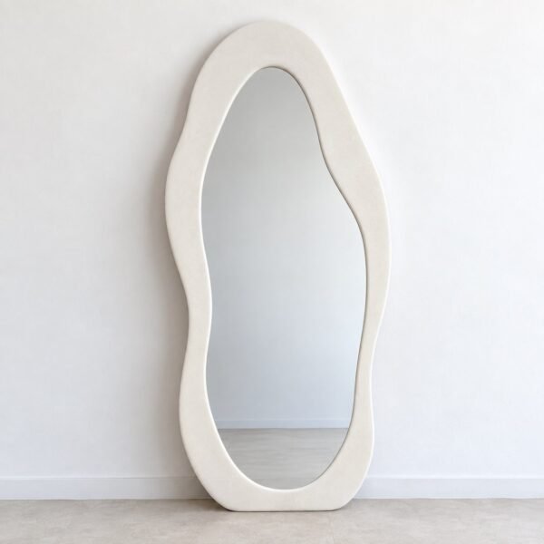 Saha organic off-white leaner mirror standing against a plain white wall