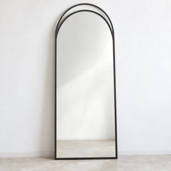 Ayla Arch Leaner Mirror with slim charcoal-black frame against a plain white wall