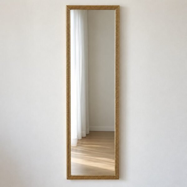 Ayla rectangular antique-gold framed wall mirror on a plain white wall