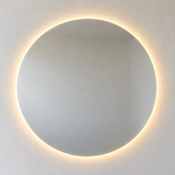 Round frameless LED wall mirror on a plain white wall