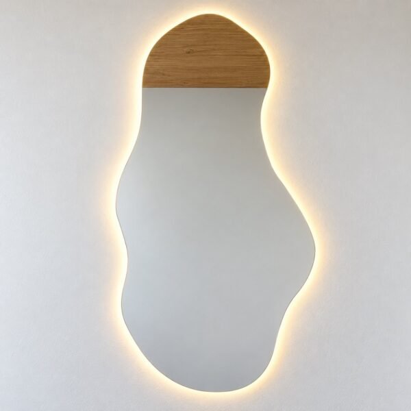 Tall organic LED wall mirror with a warm wood cap on a plain white wall.