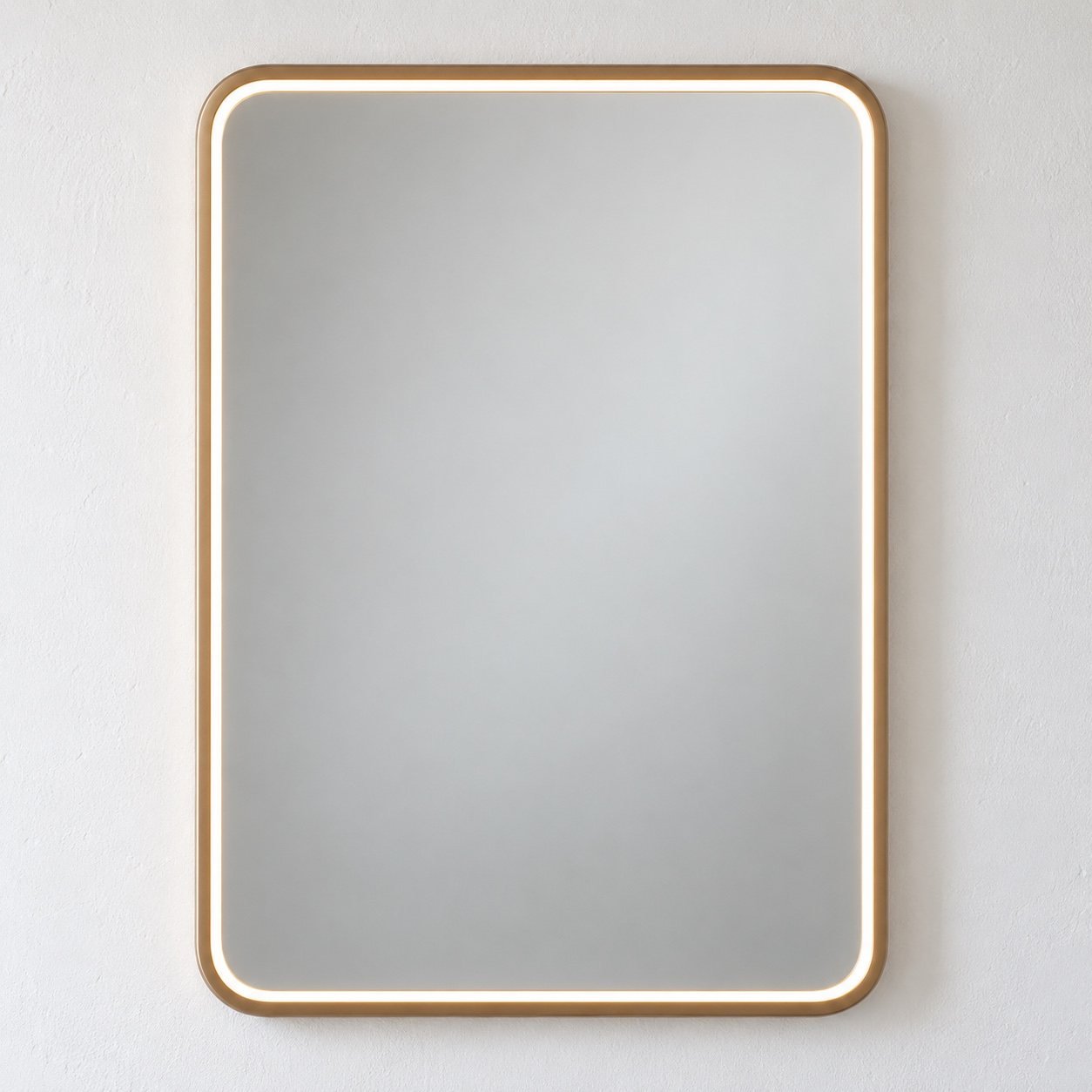 SeraGlow rounded rectangular LED wall mirror with a warm champagne-beige aluminium frame on a plain white wall.