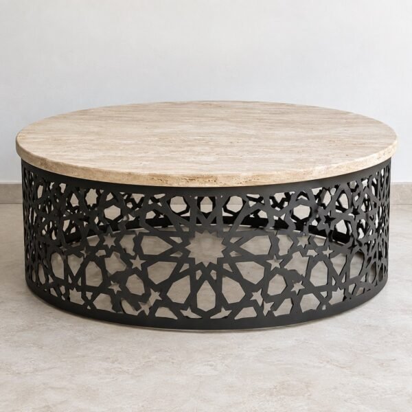round travertine outdoor majlis table with black geometric steel base on a light floor