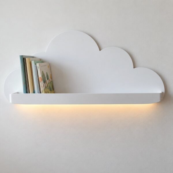 Front view of a matte white cloud-shaped metal wall shelf with warm LED glow and children’s books on a white wall.