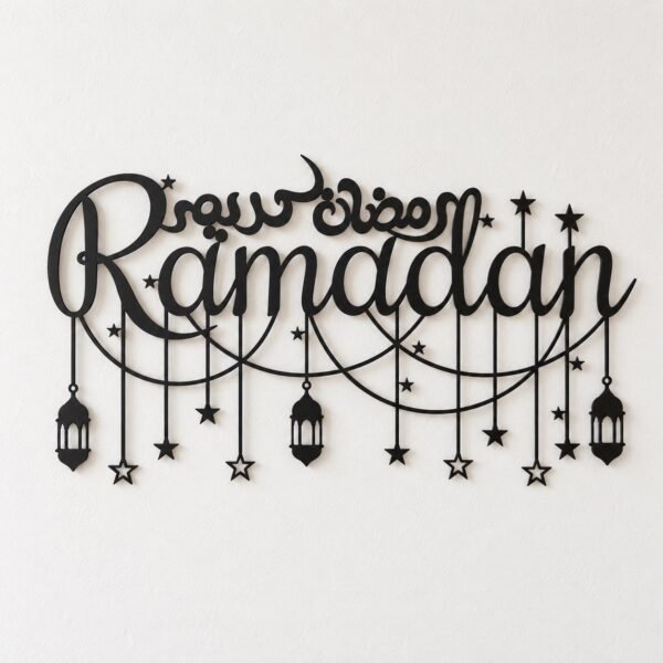 Black Ramadan metal wall art with Arabic calligraphy, stars and lanterns on a warm-white wall.