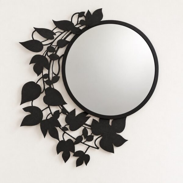 Plants Wall Mirror with round mirror and black botanical metal surround on a warm-white wall.