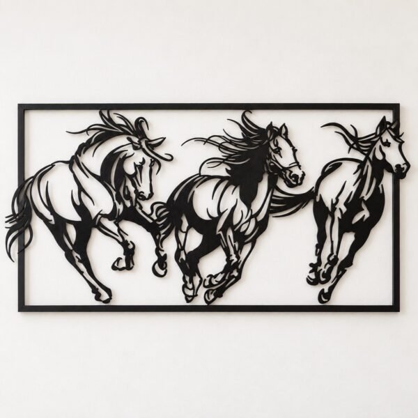Black metal wall art with three galloping horses in a rectangular frame on a warm-white wall