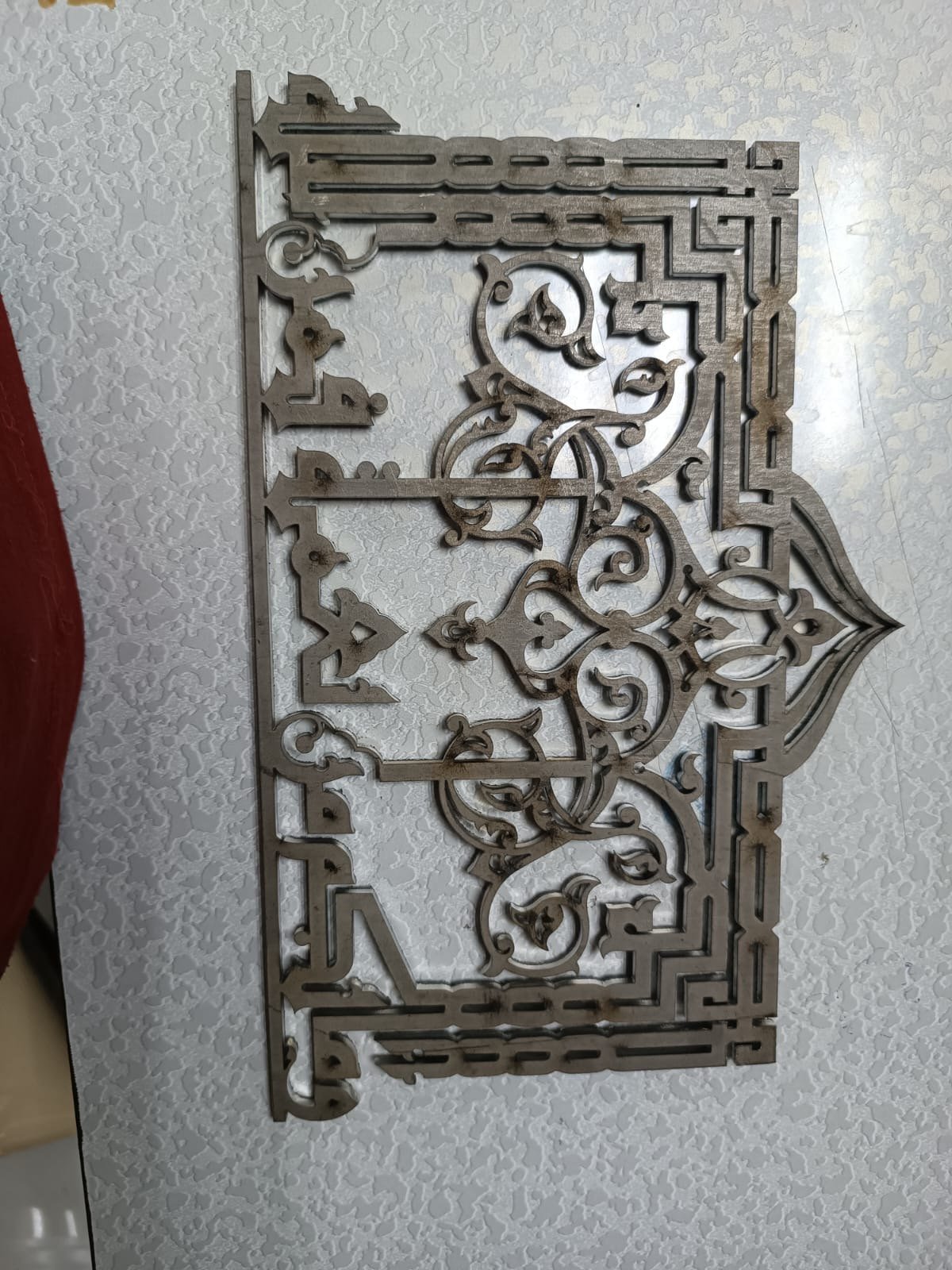 Arabesque calligraphy panel — laser-cut steel