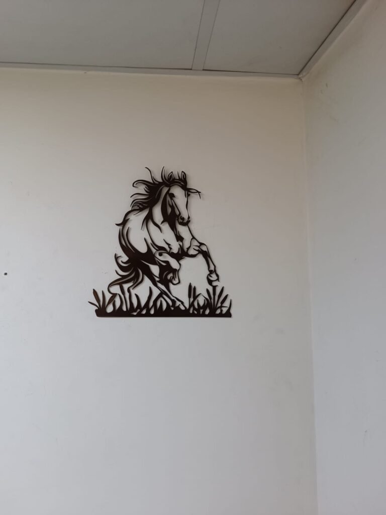 Running horse metal wall art in place